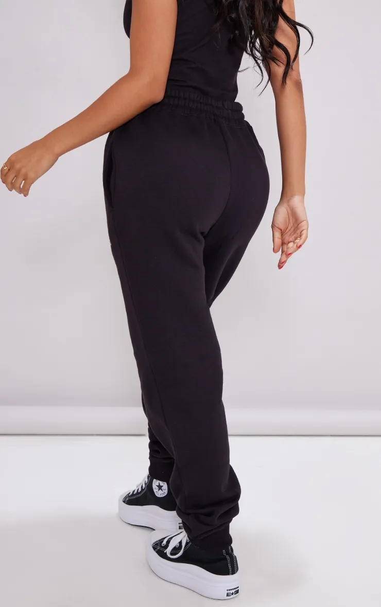 PRETTYLITTLETHING Petite Pantalon de jogging noir taille haute à bas resserré